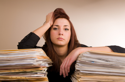 Woman with stacks of papers